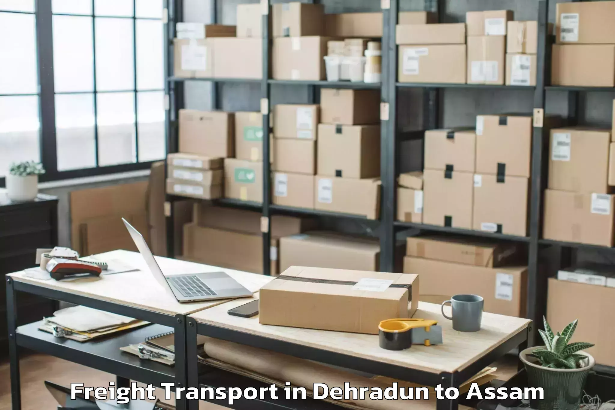 Book Dehradun to Bokolia Freight Transport Online